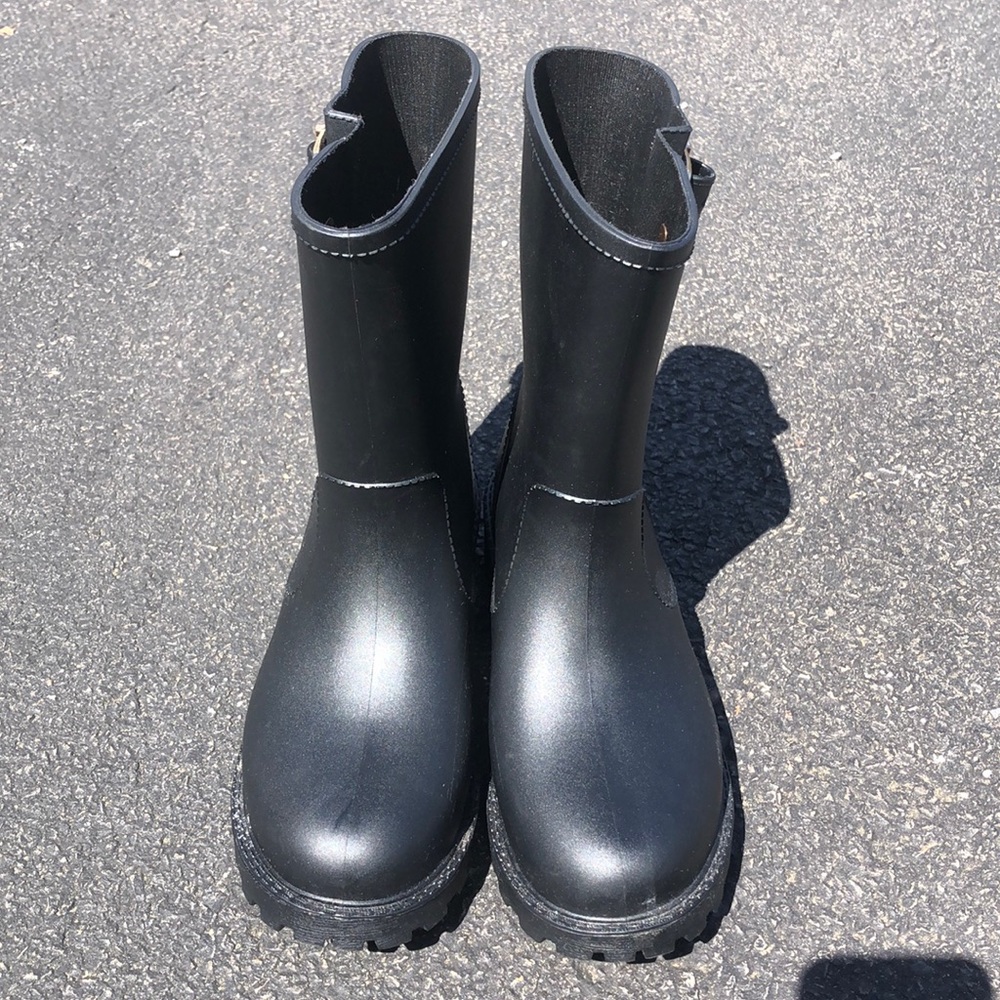 Black rain boots with gold buckle